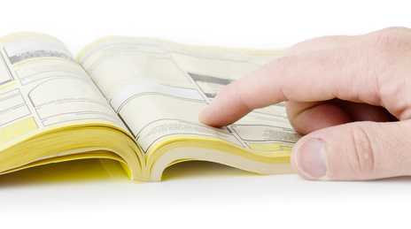 yellow pages searching with finger, blank spaces for text input. all information burred
